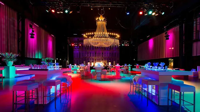 Hall with a chandelier and illuminated bars