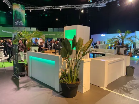 White exhibition stands with plants