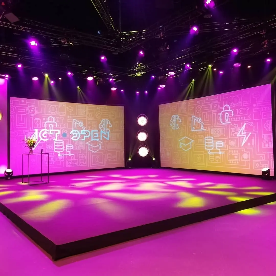 Stage with large screens and purple light